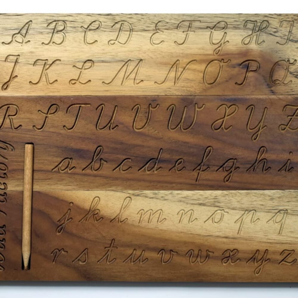 A wooden letter tracing board with letters A-Z engraved