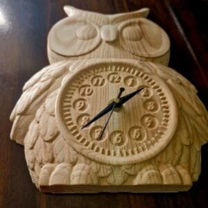 Close-up of Antique Owl Wall Clock featuring fine wood engravings