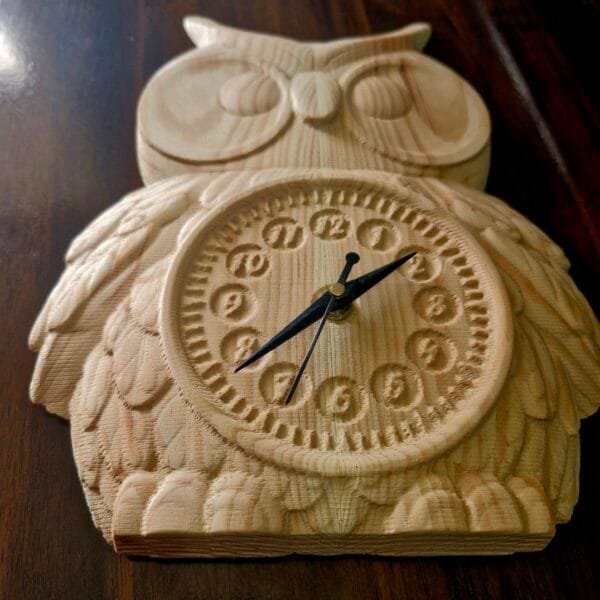 Close-up of Antique Owl Wall Clock featuring fine wood engravings