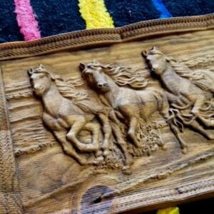Close-up of Wooden Horse Art Frame with intricate engravings